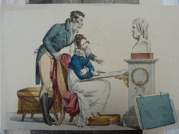Drawing of a woman and a man examining folios, near a Greco-Roman bust. The woman, appearing as a student, is seated. The man, likely a teacher, stands leaning toward her. Both wear antique dress. A restoration or drawing tool is visible on the folio.