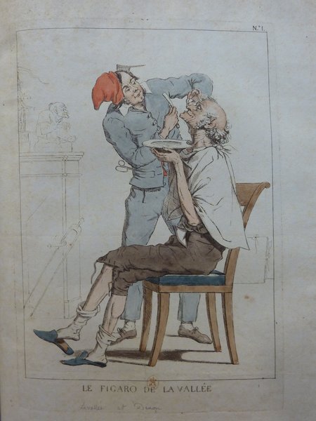 Illustration depicting an indoor scene where a barber, identified as "Le Figaro de la Vallée", is shaving an elderly man seated on a wooden chair. The barber, wearing a long coat and a red hat, holds a shaving bowl and razor. The setting includes partial sketches of architectural features and a statue in the background. This folio is linked to Dominique Vivant Denon and illustrates an occupation theme.