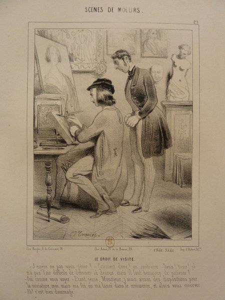 A lithograph depicting a studio scene during the July Monarchy period with two individuals observing a printmaking process. One man with long hair, wearing a hat, is sitting and working on a folio, while standing next to him appears a bourgeois man, observing the work. The studio is decorated with statues and artworks, reflecting a bohemian environment.