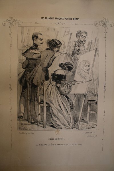 Black and white illustration depicting a group of people in a museum setting, focused around a painter's easel. There are visible elements such as artists' brushes, palettes, easels, and a mahlstick. The scene includes a man with long hair typical of the Bohemian style, likely a painter, accompanied by women and other onlookers, suggesting a romantic theme. The characters are detailed and positioned in close proximity while engaging with the artwork.