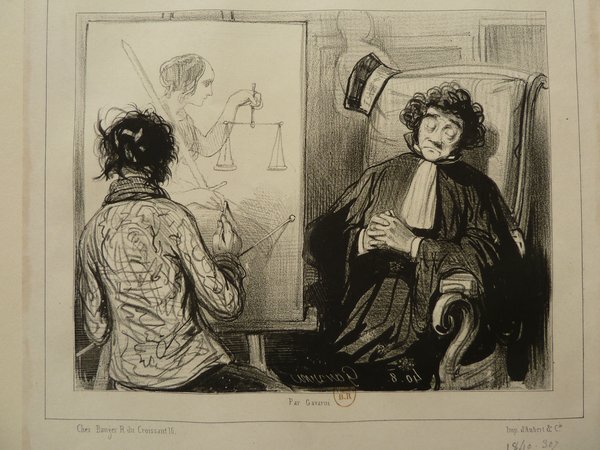 An artist with long hair, depicted as a Bohemian, holds a mahlstick while painting a bourgeois man in a studio. The sitter wears a dark outfit with a white neckcloth and sits next to an easel displaying the drawing of a woman. Various artist tools like paintings and an easel are visible.