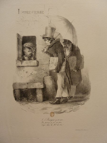 A lithograph depicting a bourgeois man in a top hat and pince-nez, holding an umbrella and papers, conversing with a printmaker through a lithographic print store's window, with a storefront and street scene visible in the background.